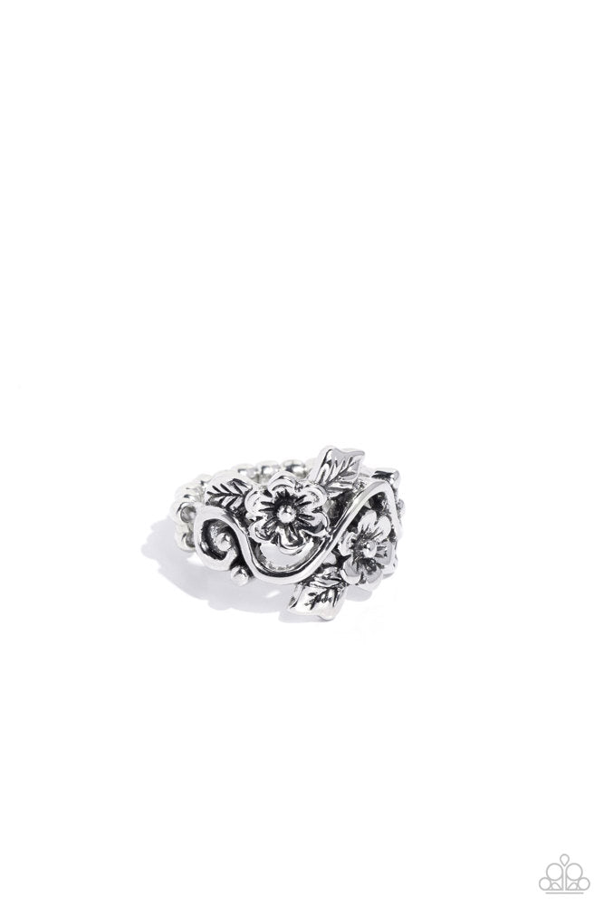 Backyard Beauty - Silver Flower Ring - Paparazzi Accessories - Brushed in an antiqued finish, leafy silver flowers and leaves bloom across the finger on an airy silver vine for a seasonal look. Features a dainty stretchy band for a flexible fit. Sold as one individual ring.