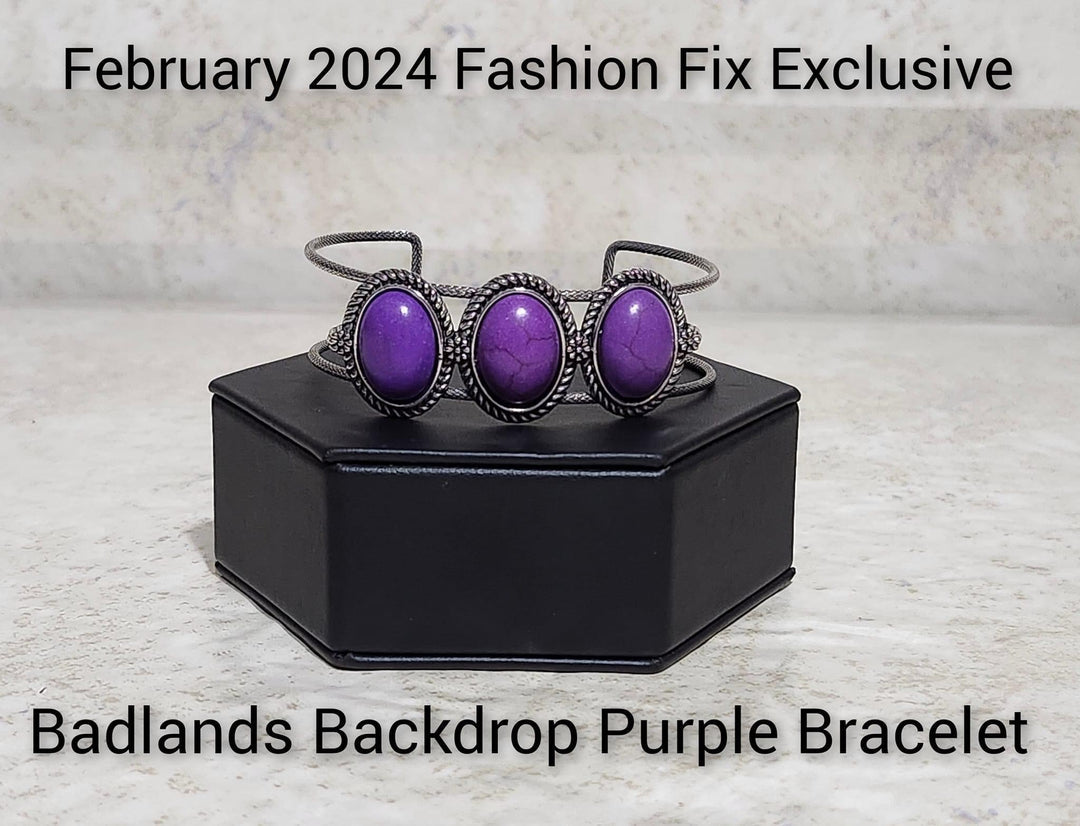 Badlands Backdrop - Purple Bracelet - Paparazzi Accessories - A trio of purple stones, pressed into twisted and textured silver frames graces the top of an airy silver cuff. Dainty floral details separate each stony frame, adding a floral finish to the design.