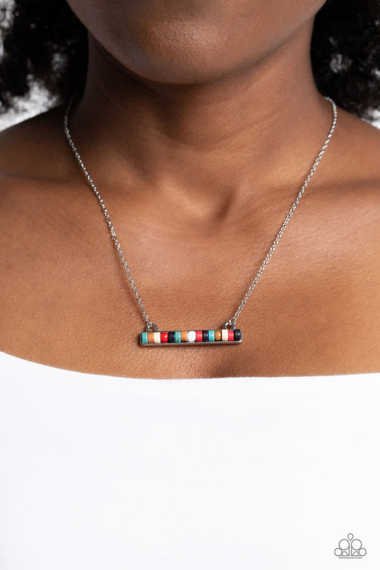 Barred Bohemian - Multi Color Necklace - Paparazzi Accessories - Cascading from a dainty silver chain, a collection of earthy turquoise, adobe, white, red, and black stone discs and beads are set in a square silver bar setting, creating an understated, harmonious display.