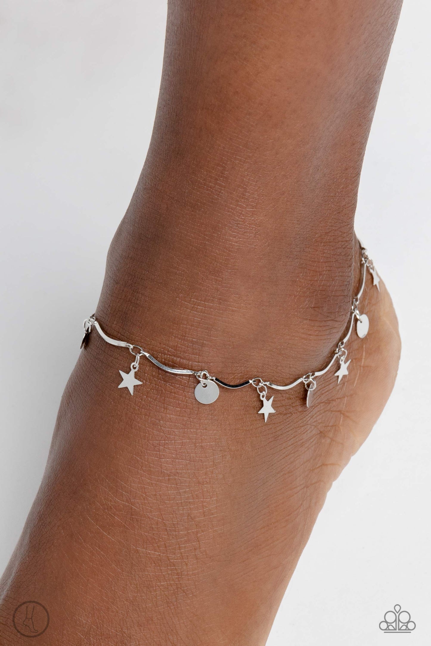 BEACH You To It - Silver Anklet - Paparazzi Accessories - A fringe of sleek silver stars and discs swings from a dainty silver overlay chain, creating whimsical movement around the ankle. Features an adjustable clasp closure. Sold as one individual anklet.