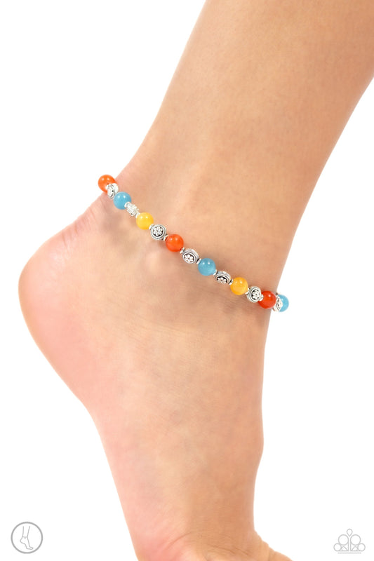 Beachy Bouquet - Multi Color Anklet - Paparazzi Accessories - Infused along an invisible wire, a glowing collection of blue, orange, and yellow cat's eye stones alternate with floral motif textured silver beads for a beachy statement around the ankle. Features an adjustable clasp closure. Sold as one individual anklet.