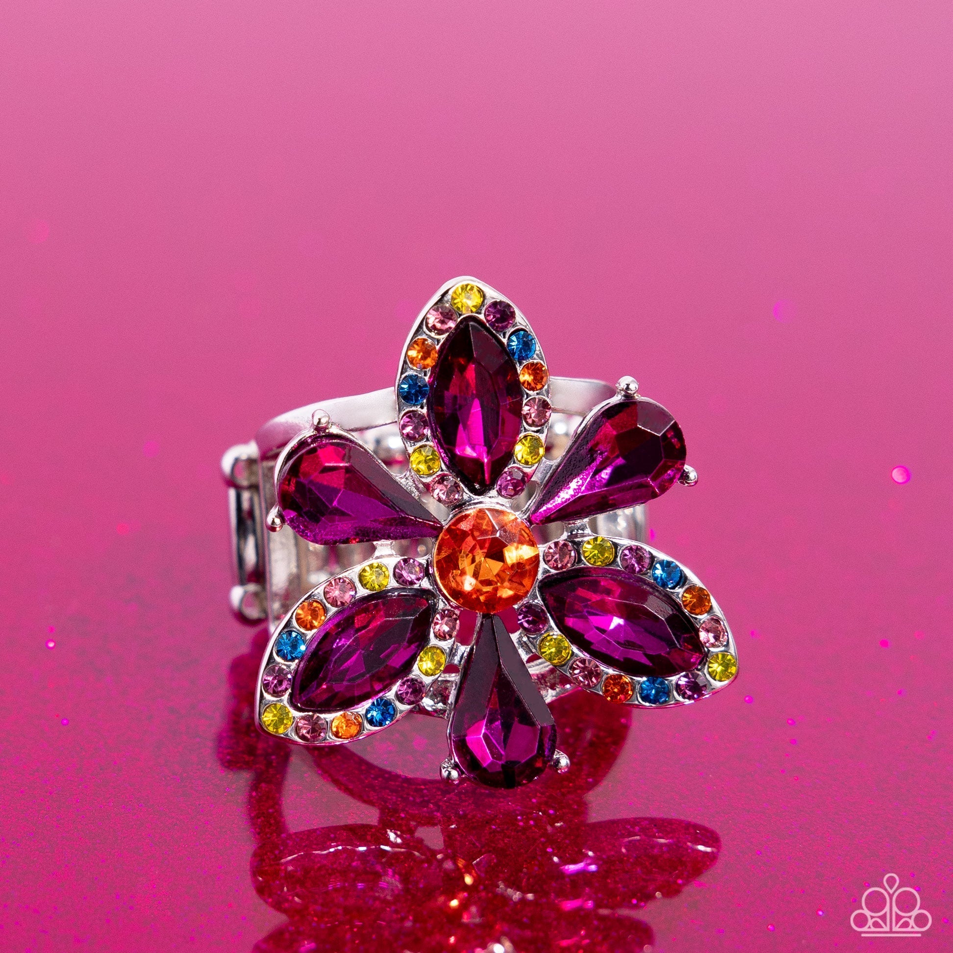 Blazing Blooms - Multi Color Ring - Paparazzi Accessories - Featured atop airy silver bands, a silver-pronged fitted flower with purple teardrop and marquise-cut petals blooms from an orange center atop the finger. Dainty multicolored rhinestones are embellished on the marquise-cut petals' frames for additional eye-catching color.
