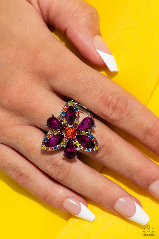 Blazing Blooms - Multi Color Ring - Paparazzi Accessories - Featured atop airy silver bands, a silver-pronged fitted flower with purple teardrop and marquise-cut petals blooms from an orange center atop the finger. Dainty multicolored rhinestones are embellished on the marquise-cut petals' frames for additional eye-catching color.
