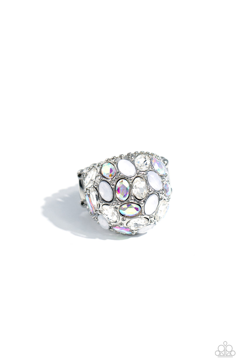 BLING Loud and Proud - White Iridescent Ring - Paparazzi Accessories - A studded silver frame, filled with blinding oval-cut gems in opalescent, white, and iridescent shades, stands out atop the finger for a blingy statement. Features a stretchy band for a flexible fit.