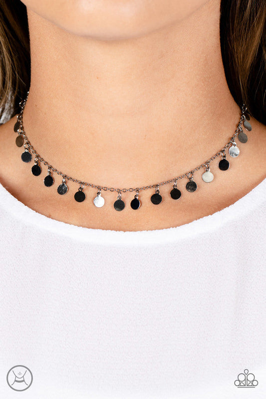 Champagne Catwalk - Black Choker Necklace - Paparazzi Accessories - Tiny gunmetal discs dance along a classic gunmetal chain, creating an understated choker necklace. The reflective surfaces of the discs shimmer brightly, as the light catches their high sheen finish to exaggerate their intensity.