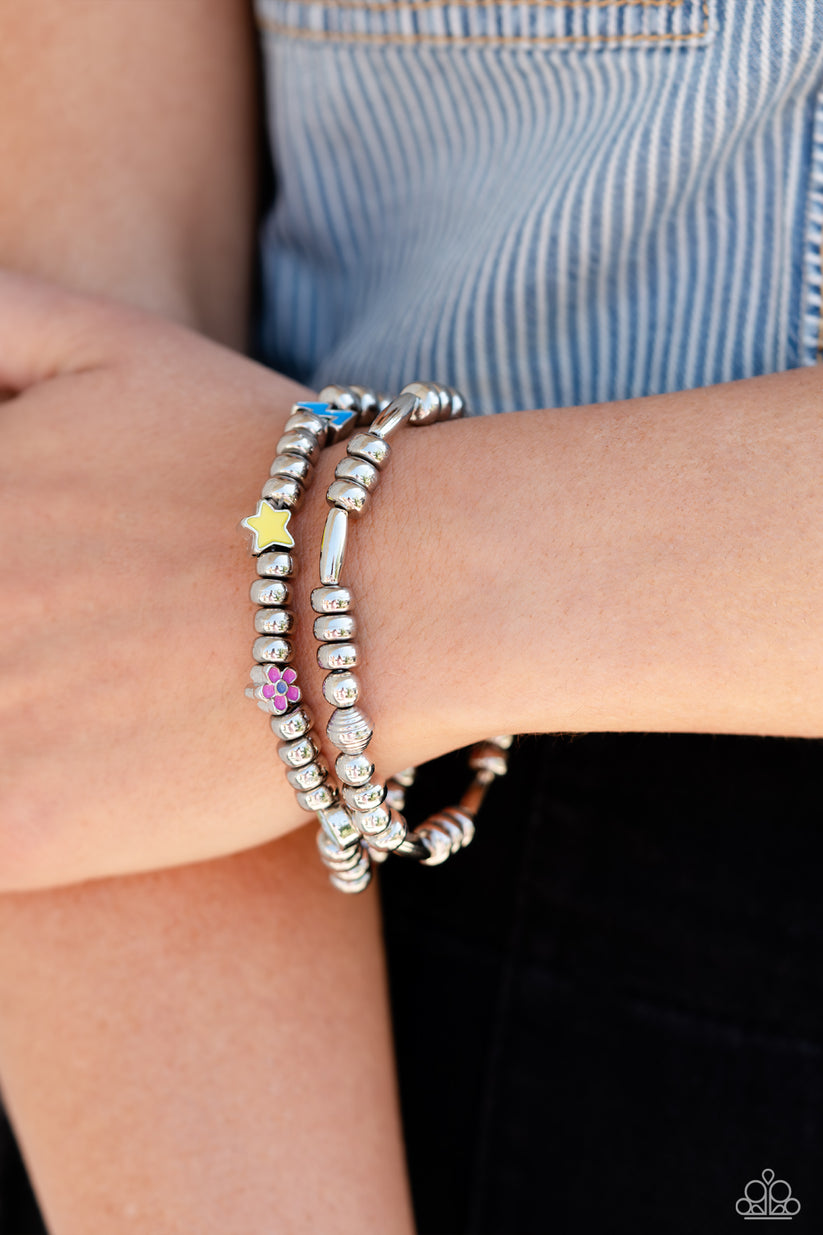 Charming Campaign - Multi Color Bracelet - Paparazzi Accessories - High-sheen silver beads combines with a single strand of silver beads, sporadically infused with vivacious charm beads to create an energetic stack of stretchy bracelets. The colorful beaded stack features a yellow star, blue lightning bolt, green money bag, orange tropical flower, red lips, blue and green earth, pink and purple flower, and a pink heart charm with the words "love me" for a youthful finish. 