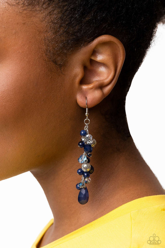 Cheeky Cascade - Blue and Silver Earrings - Paparazzi Accessories - A dainty collection of blue teardrop and round beads, textured silver accents, and faceted blue crystal-like beads trickle from a single strand of silver chain, resulting in a cheekily clustered chandelier.