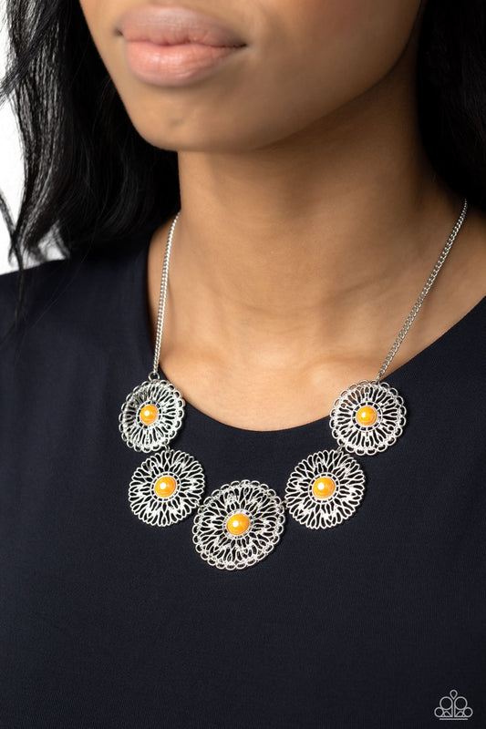 Chrysanthemum Craze - Orange and Silver Necklace - Paparazzi Accessories - Infused with a whimsical layered motif, tactile silver petals bloom from glassy orange dotted centers below the collar for an eye-catching statement.
