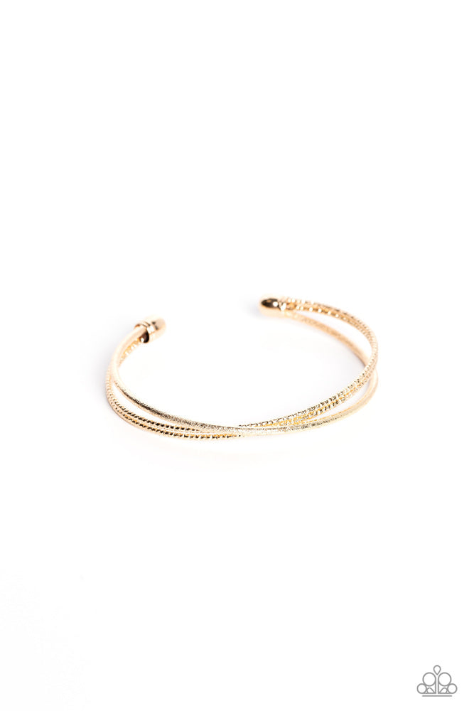 Coachella Curls - Gold Cuff Bracelet - Paparazzi Accessories - One strand of glittery gold and one double strand of textured gold crisscross across the wrist, coalescing into a versatile cuff around the wrist. Sold as one individual bracelet.