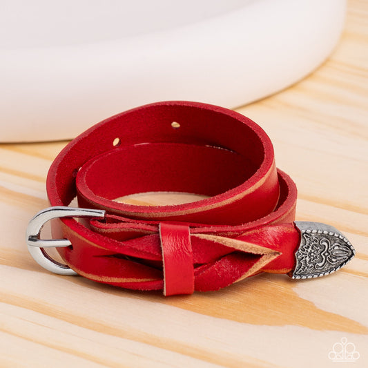 Coat of Arms Couture - Red Leather Bracelet - Paparazzi Accessories - Featuring a weathered finish, a red leather band loops around the wrist in a belt loop fashion. Featured at the end of the loop, the leather braids into a silver cap fitting, embossed with a coat of arms style filigree for an urban statement. Features an adjustable belt loop closure.