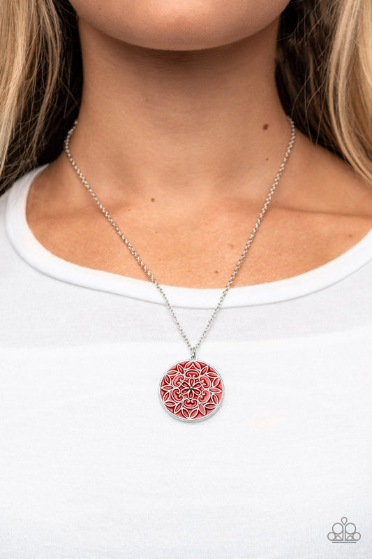 Colorfully Cottagecore - Red and Silver Necklace - Paparazzi Accessories - A mandala-like floral motif is embossed across the front of a shiny red frame, resulting in a whimsical pendant at the bottom of a dainty silver chain.