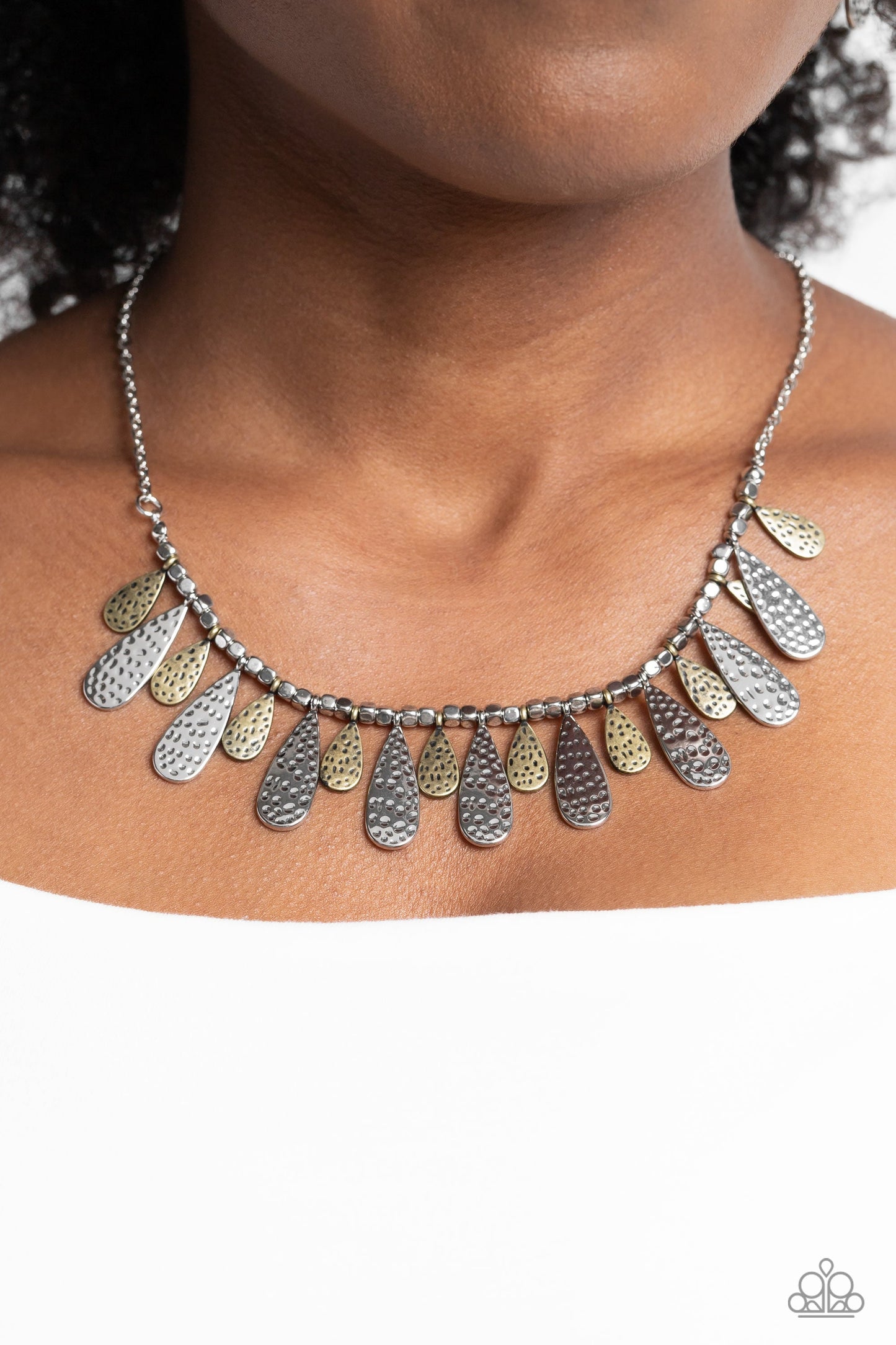 Compelling Confetti - Multi Metal Necklace - Paparazzi Accessories - Streaming from a collection of abstract silver studs, brass and silver, metallic teardrops in varying sizes curve up towards the neckline. Featuring a hammered dot motif, the boisterous collection of studs and teardrops hangs from a classic silver chain creating a magnetic statement.