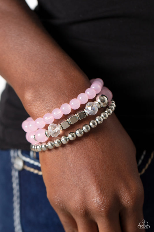 CUBE Your Enthusiasm - Pink and Silver Bracelet - Paparazzi Accessories - Varying in shape and size, shiny silver beads, silver cube beads, silver accents, baby pink opaque beads, and reflective crystal-like beads are threaded along elastic stretchy bands, creating colorful layers across the wrist. Sold as one set of three bracelets.