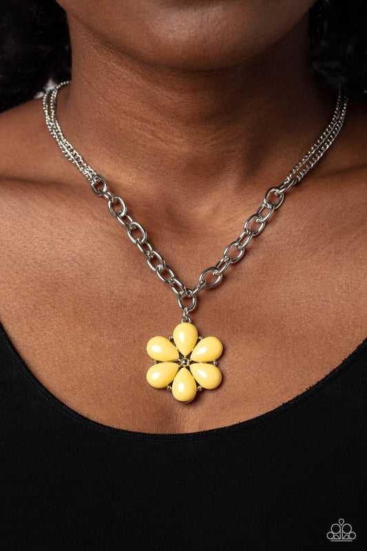 Dazzling Dahlia - Yellow and Silver Necklace - Paparazzi Accessories - Primrose acrylic petals bloom from and around silver-studded accents and a studded center. The colorful display hangs from a collection of thick silver oval links that interlock and hang below a double-layered silver chain for a bright, floral finish.
