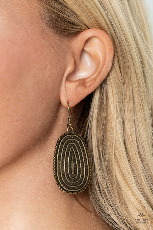 Desert Climate - Brass Earrings - Paparazzi Accessories - Rows of antiqued brass dotted texture radiate outward from an embossed center. The concentric lines create a rippling effect across the frame resulting in a rustic finish.