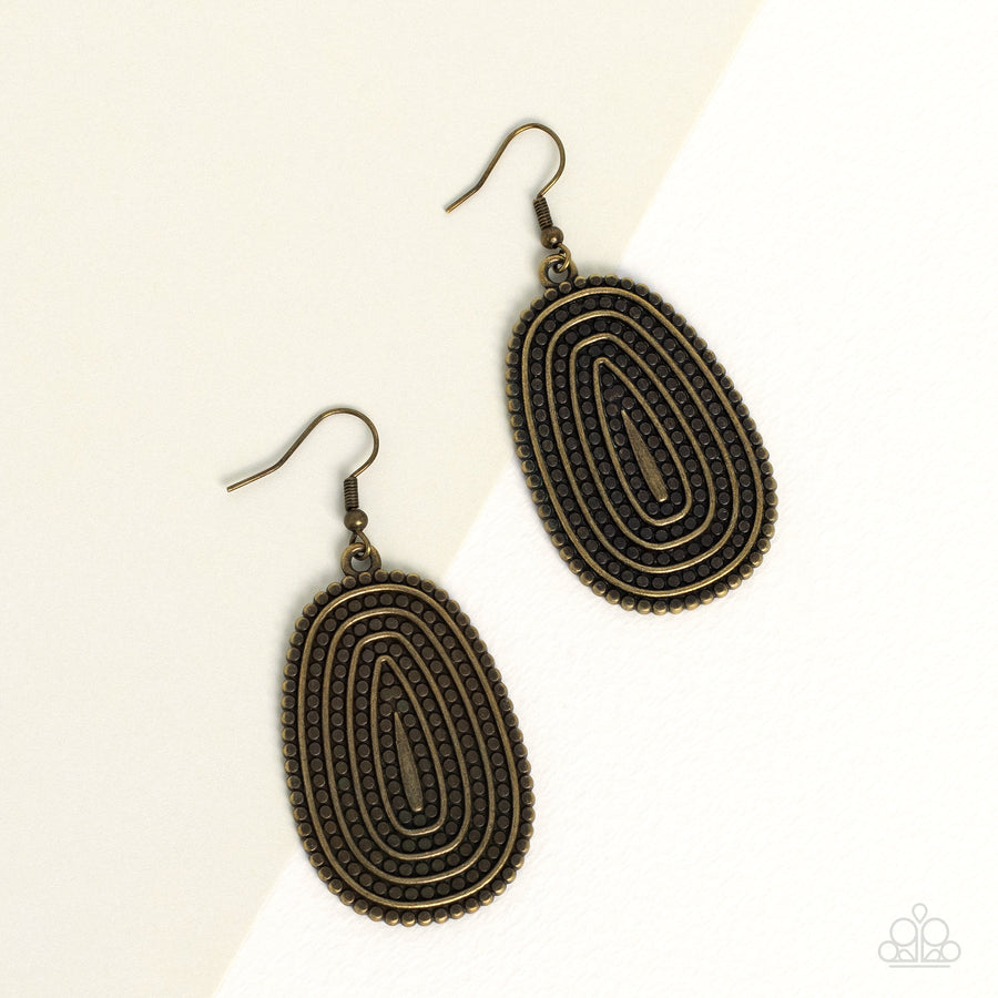 Desert Climate - Brass Earrings - Paparazzi Accessories - Rows of antiqued brass dotted texture radiate outward from an embossed center. The concentric lines create a rippling effect across the frame resulting in a rustic finish.