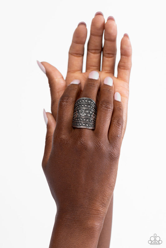 Diamondback Bravado - Silver Ring - Paparazzi Accessories - Brushed in an antiqued shimmer, rows of diamond shaped studs and chain-like texture alternates across the front of an oval silver frame for a rustic flair.