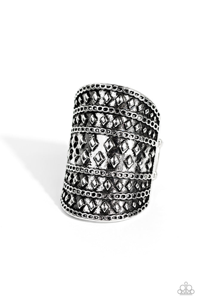 Diamondback Bravado - Silver Ring - Paparazzi Accessories - Brushed in an antiqued shimmer, rows of diamond shaped studs and chain-like texture alternates across the front of an oval silver frame for a rustic flair.