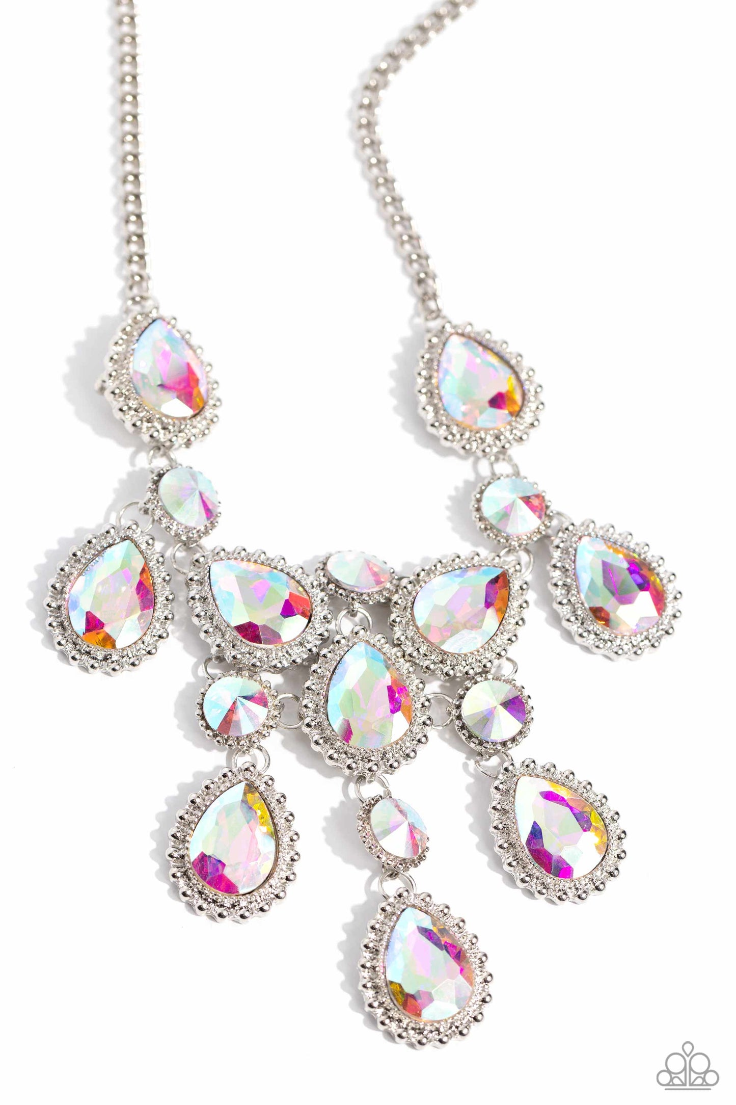 Dripping in Dazzle - Multi Iridescent Necklace - Paparazzi Accessories - An explosion of round, teardrop, and marquise-cut gems in varying sizes bordered by tactile silver studs cluster together to create a glittery iridescent showcase down the neckline. Featuring various shades of iridescence, each gem reflects light off of its faceted surface emitting further glitz and glam.