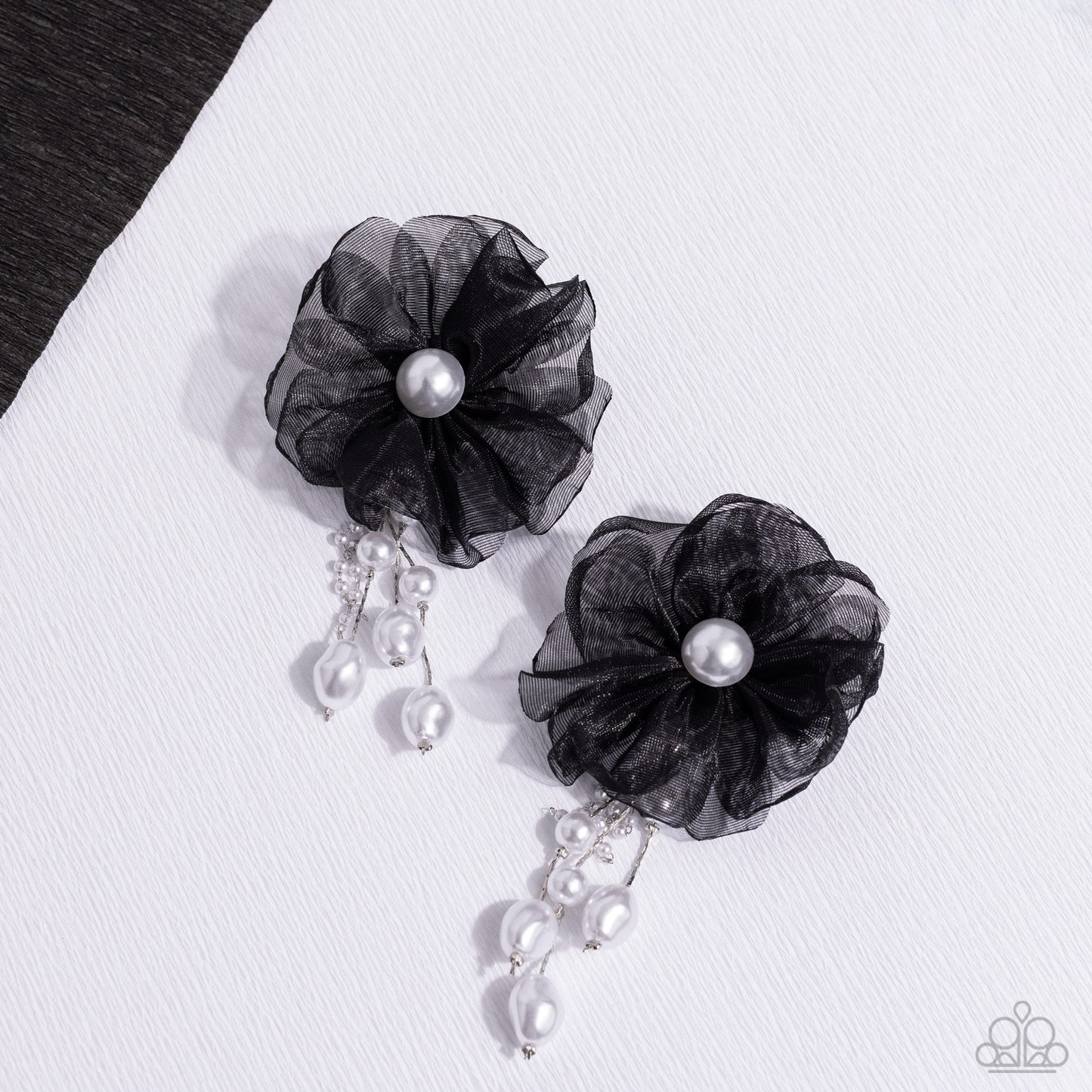Dripping In Decadence - Black and White Pearl Earrings - Paparazzi Accessories - Folds of black netting gather around a glossy white pearl center, creating a spunky blossom. Cascading from the black netted petals, various white pearls in glossy, baroque, and dainty settings are infused along silver cobra chains for a refined finish. Earring attaches to a standard post fitting. Sold as one pair of post earrings.