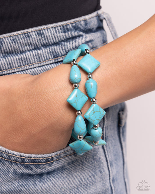 EARTHY Riser - Blue Turquoise Bracelet - Paparazzi Accessories - Infused along elastic stretchy bands, turquoise stones in various shapes and silver beads alternate along the wrist for an earthy centerpiece. Sold as one set of two bracelets.