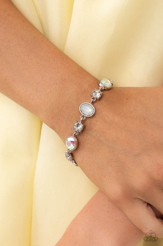 Ethereal Empathy - White Gem Bracelet - Paparazzi Accessories - Featuring pronged silver fittings, white solitaire rhinestones alternate with oval opalescent and iridescent gems, linking around the wrist for a timeless, dreamy finish.
