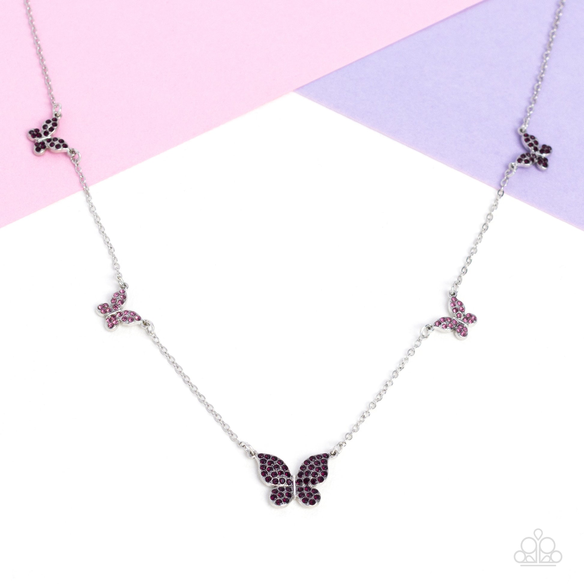 FAIRY Special - Purple Butterfly Necklace - Paparazzi Accessories - Floating along a dainty silver chain, a collection of silver butterflies in varying sizes coalesces around the neckline for a whimsical finish. Each butterfly features a monochromatic shimmer of amethyst and light amethyst rhinestones for a sparkly statement.