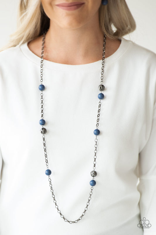 Fashion Fad - Blue Necklace - Paparazzi Accessories - Shiny blue beads and ornate gunmetal beads trickle along a bold gunmetal chain, creating a colorfully industrial look across the chest.