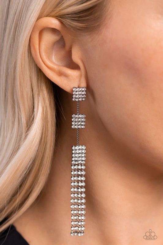 Fiercely Free-Falling - Black Earrings - Paparazzi Accessories - Enveloped in white rhinestones, three interconnected gunmetal square frames cascade down the ear resulting in a dazzling drop of glitz. Featuring sleek square fittings, strands of glittery white rhinestones freefall from the lowermost square frame, creating a glamorous fringe. Earring attaches to a standard post fitting.  Sold as one pair of post earrings.