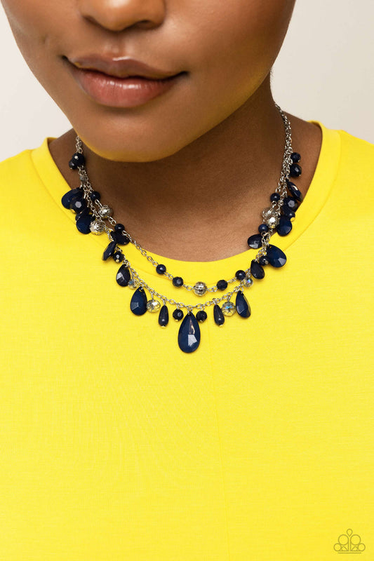 Flirty Flood - Blue and Silver Necklace - Paparazzi Accessories - A boisterous collection of blue teardrop and round beads, textured silver accents, and faceted blue crystal-like beads trickle from a double strand of silver chain, resulting in flirtatious layers down the neckline.