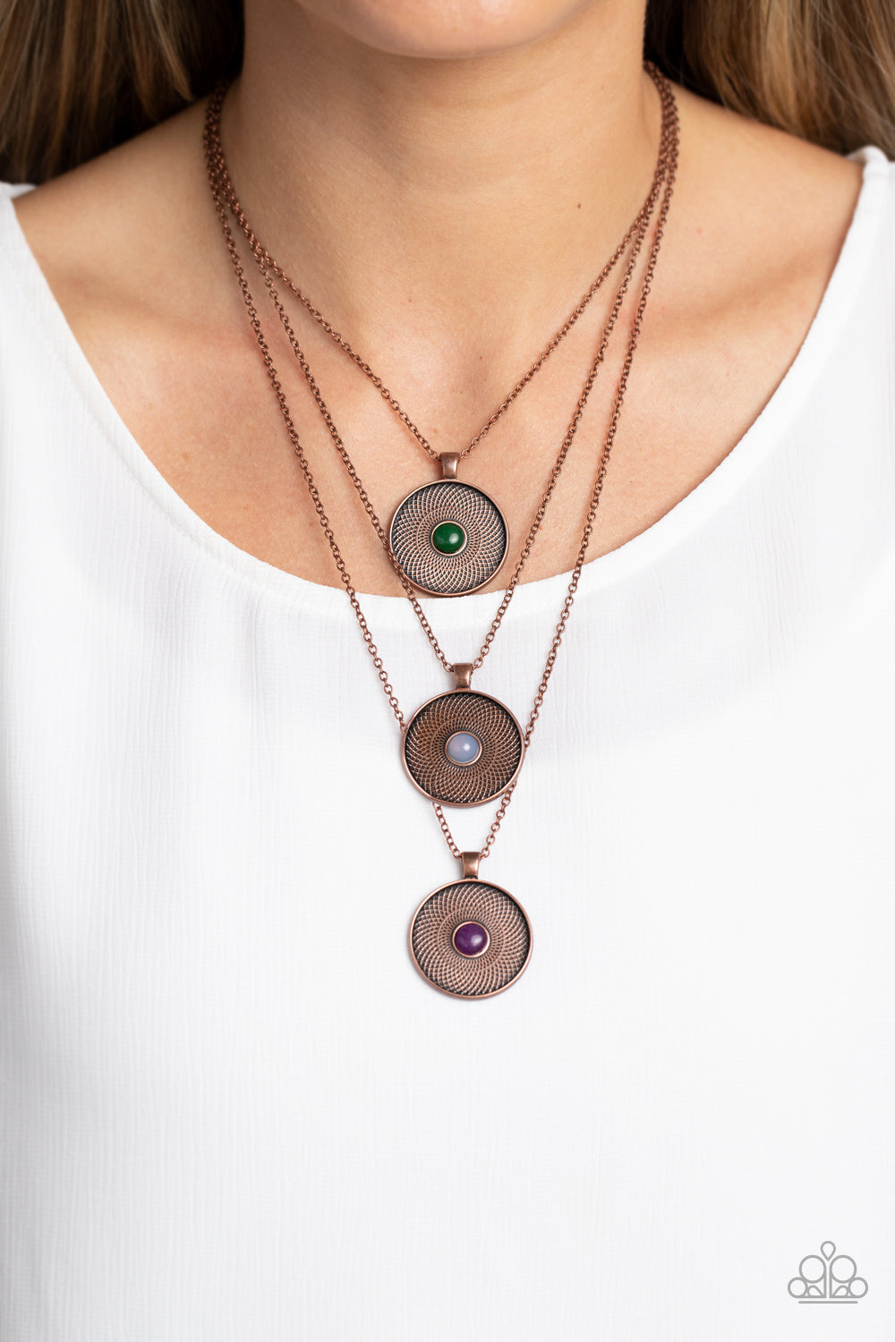 Geographic Grace - Copper Necklace - Paparazzi Accessories - Stamped with a floral motif, oversized copper pendants trickle from three layered chains below the neckline for a casual style. Featured in the center of each disc, a jade, opal white, and amethyst stone create a pop of color against the textured backdrop. Features an adjustable clasp closure. As the stone elements in this piece are natural, some color variation is normal.

Sold as one individual necklace.