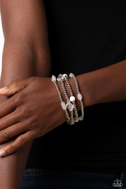 Geometric Guru - White and Silver Bracelets - Paparazzi Accessories - Dainty silver beads, silver accents, and white acrylics in milky, transparent, and solid shades wrap around the wrist on elastic stretchy bands for a colorfully geometric display. Sold as one set of four bracelets.