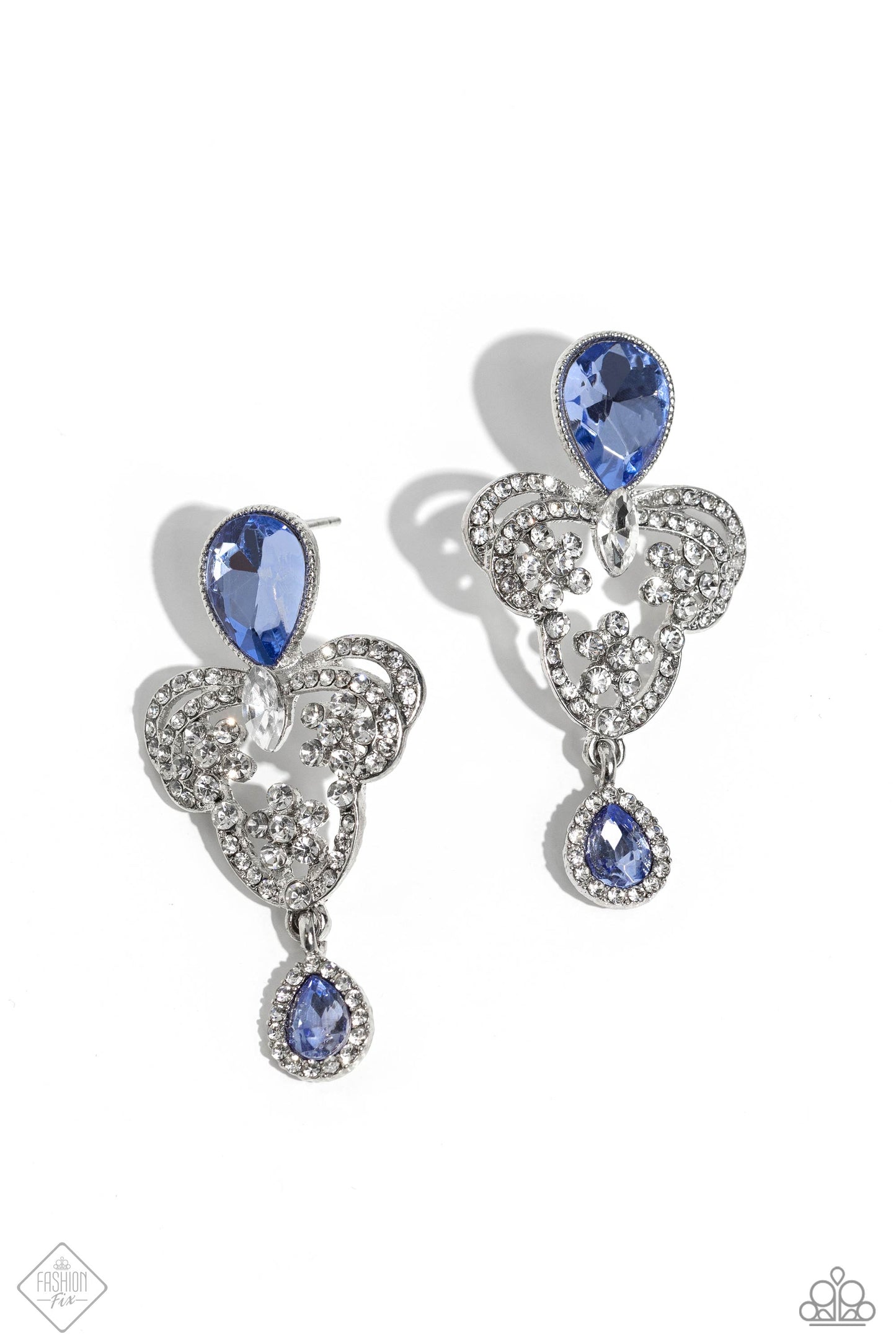 Giving Glam - Blue and Silver Earrings - Paparazzi Accessories - Pressed in a silver textured frame, an upside-down blue teardrop gem gives way to a silver, decorative, chandelier-like frame. The decorative frame swirls with dainty white rhinestones and white marquise-cut gems for a timelessly over-the-top sparkle. Bordered by glassy white rhinestones, an upright, smaller blue teardrop gem creates a dainty fringe at the bottom of the frame for an additional pop of elegant color.