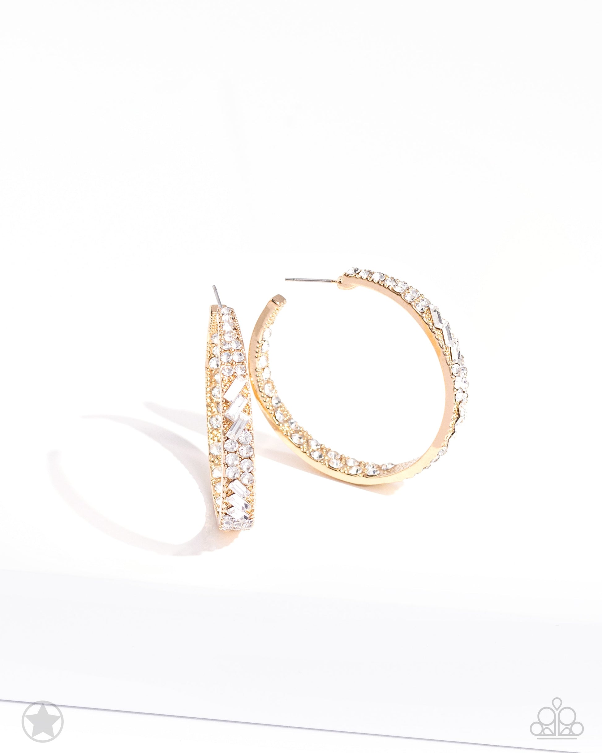 GLITZY By Association - Gold Hoop Earrings - Paparazzi Accessories - The front-facing surface of a chunky gold hoop is dipped in brilliantly sparkling white rhinestones while light-catching texture wraps around the back. The interior of the hoop features the opposite pattern, creating the illusion of a full hoop of blinding rhinestones.