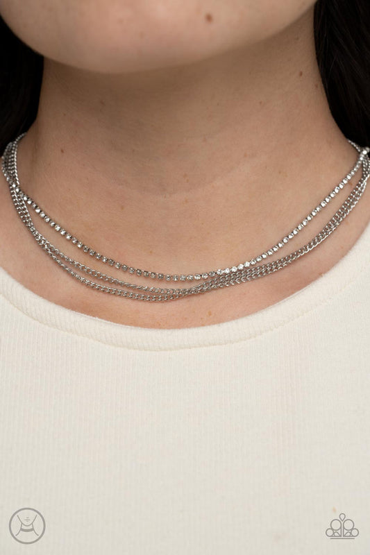 Glitzy Gusto - White and Silver Necklace - Paparazzi Accessories - Two glistening silver chains and a single strand of dainty white rhinestones effortlessly layer around the neck, resulting in a radiant necklace.