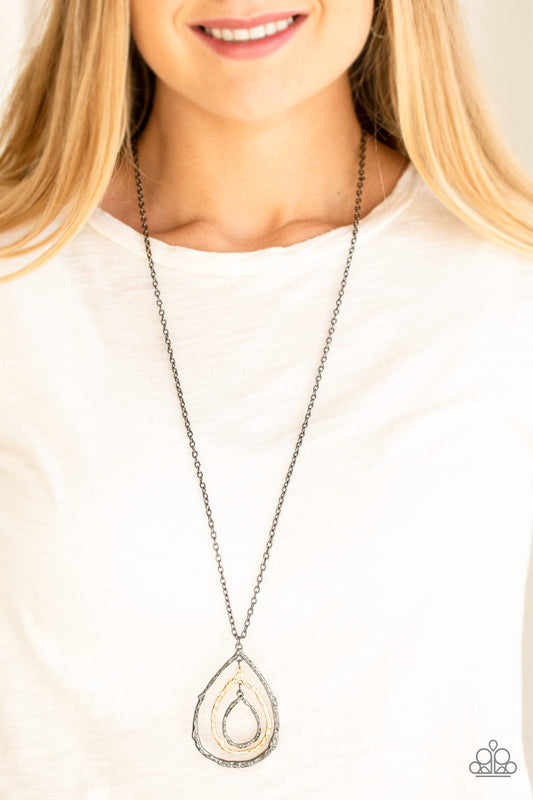 Going for Grit - Black and Gold Necklace - Paparazzi Accessories - Brushed in an antiqued shimmer, delicately hammered copper, gold, and gunmetal teardrop silhouettes swing from the bottom of a lengthened gunmetal chain for a rustic look.