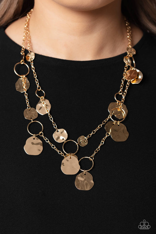 Hammered Horizons - Gold Necklace - Paparazzi Accessories - Infused along a double-stranded gold chain, smooth gold hoops and abstract, hammered gold discs fall down the neckline for an edgy, boisterous display.