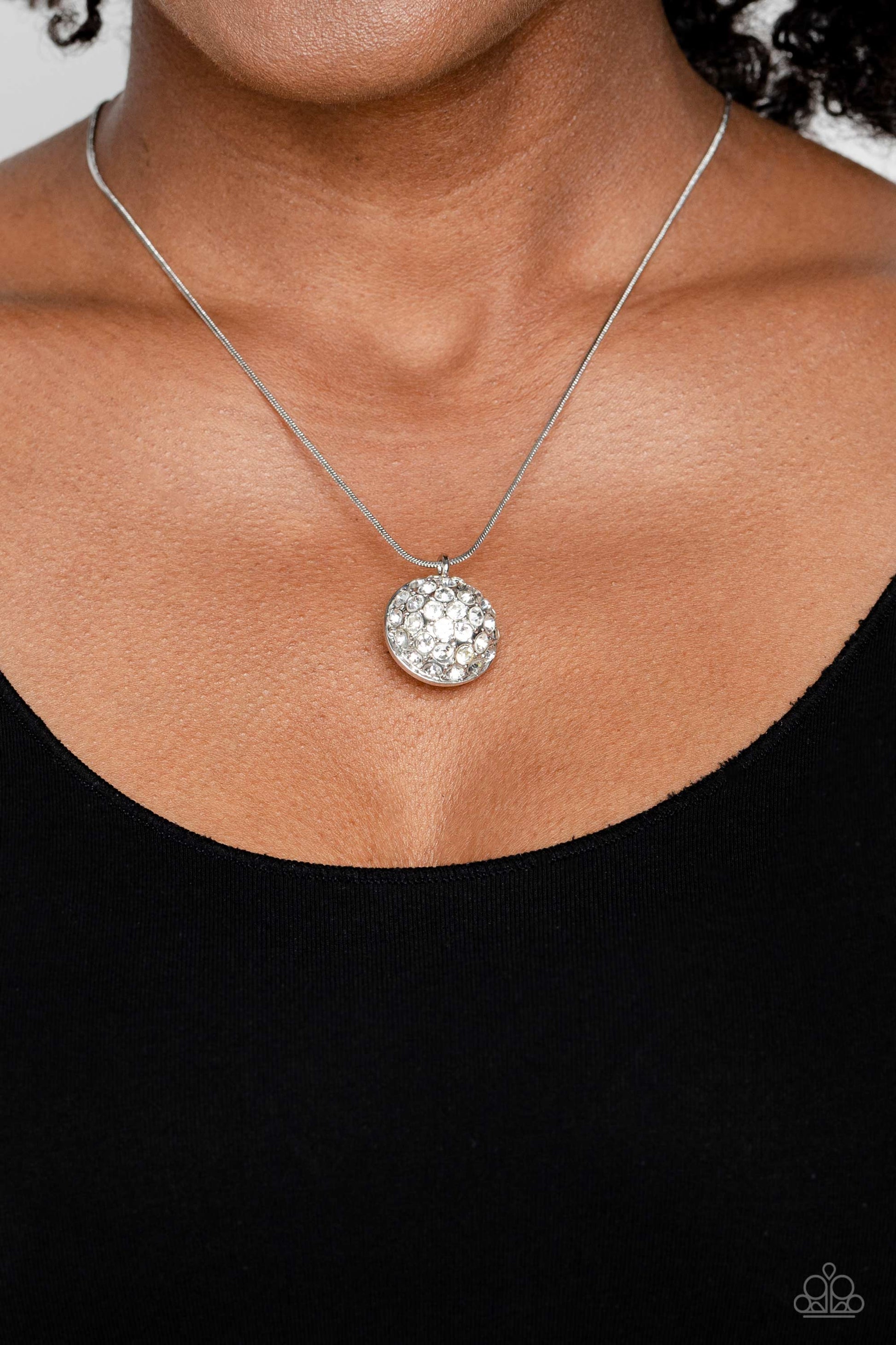 Haute Hybrid - White Pearl and Silver Necklace - Paparazzi Accessories - Cascading from a shiny silver snake chain, a sparkly white rhinestone-encrusted ornament and a classic white pearl meet to create a half-and-half refined pendant.