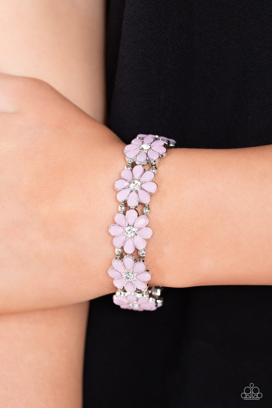 Hawaiian Holiday - Pink Flower Bracelet - Paparazzi Accessories - A collection of baby pink petals blooms from the center of a white crystal-like gem, creating a sparkling floral arrangement across the wrist. Separating each flower, silver beads are added along elastic bands for a high-sheen finish.