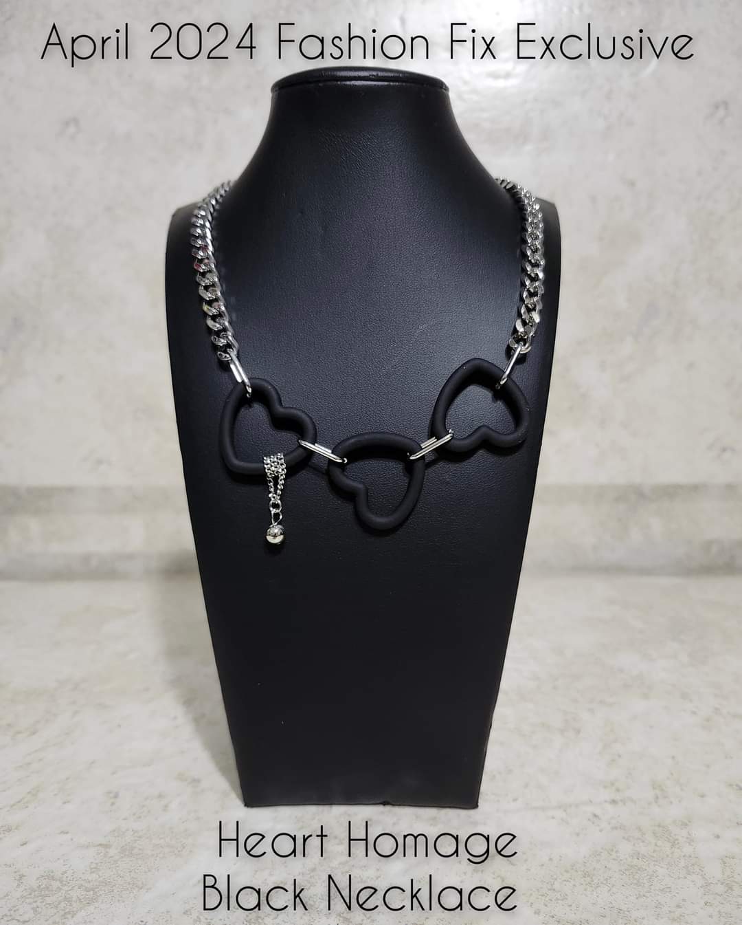 Heart Homage - Black and Silver Necklace - Paparazzi Accessories - Attached to a flat silver curb chain, a trio of black acrylic heart frames delicately link and dangle down the neckline. Wrapped along one of the frames, a silver bead dangles at the end of a dainty silver chain for a dash of swoon-worthy shimmer.