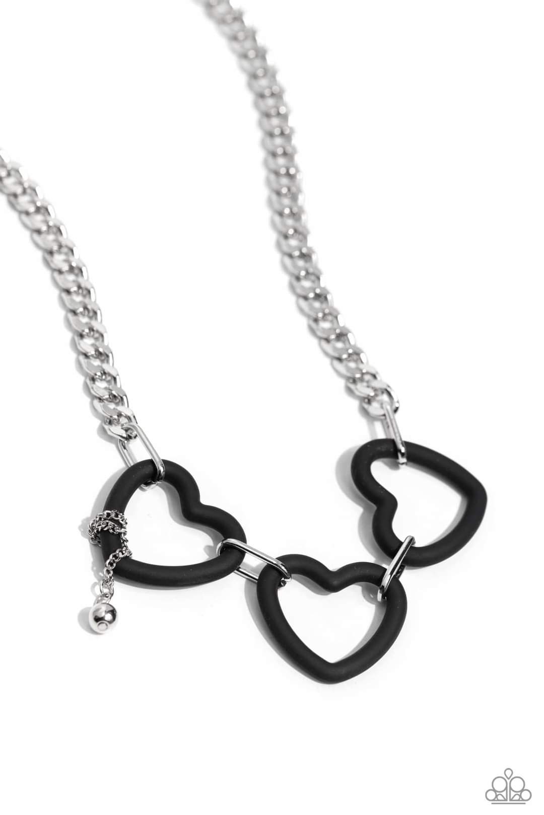 Heart Homage - Black and Silver Necklace - Paparazzi Accessories - Attached to a flat silver curb chain, a trio of black acrylic heart frames delicately link and dangle down the neckline. Wrapped along one of the frames, a silver bead dangles at the end of a dainty silver chain for a dash of swoon-worthy shimmer.
