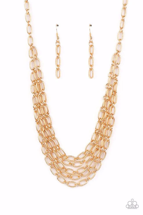 House of Chain - Gold Necklace - Paparazzi Accessories - A strand of textured gold links gives way to layers of identical chains that drape across the chest in a stunning industrial display. The textured links catch and reflect the light at every angle, adding breathtaking shimmer to the monochromatic design. Features an adjustable clasp closure. Sold as one individual necklace.