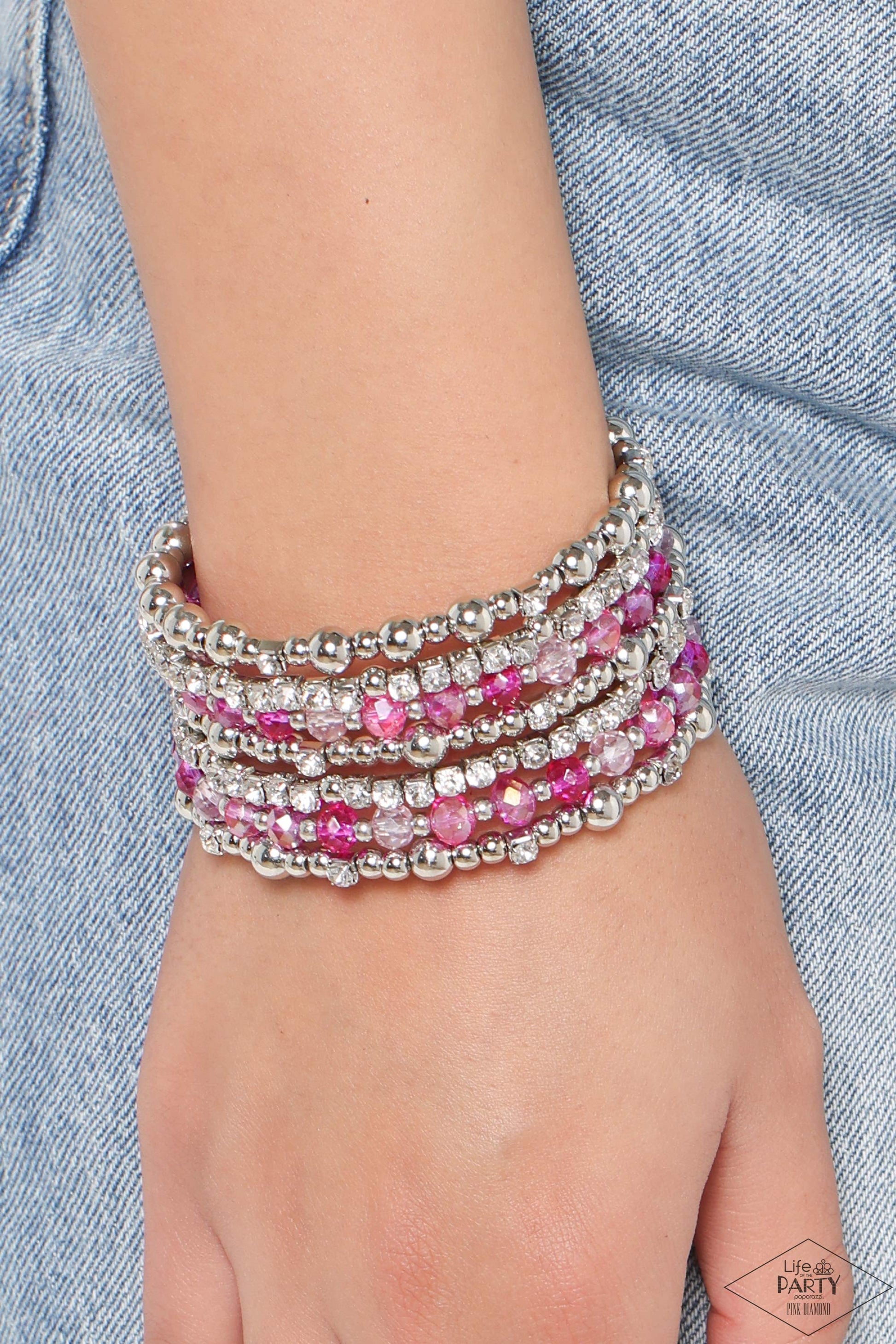 ICE Knowing You - Pink Infinity Wrap Bracelet - Paparazzi Accessories - An icy collection of silver beads, cubes, opaque crystals in various pink shades, and glassy white rhinestones are threaded along a coiled wire, creating a blinding infinity wrap style bracelet around the wrist. Sold as one individual bracelet.