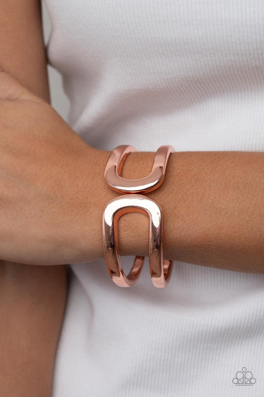 Industrial Empress - Copper Hinged Bracelet - Paparazzi Accessories - Two oversized shiny copper frames gently curl around the wrist, delicately linking into an impressive cuff-like bangle. Features a hinged closure. Sold as one individual bracelet.