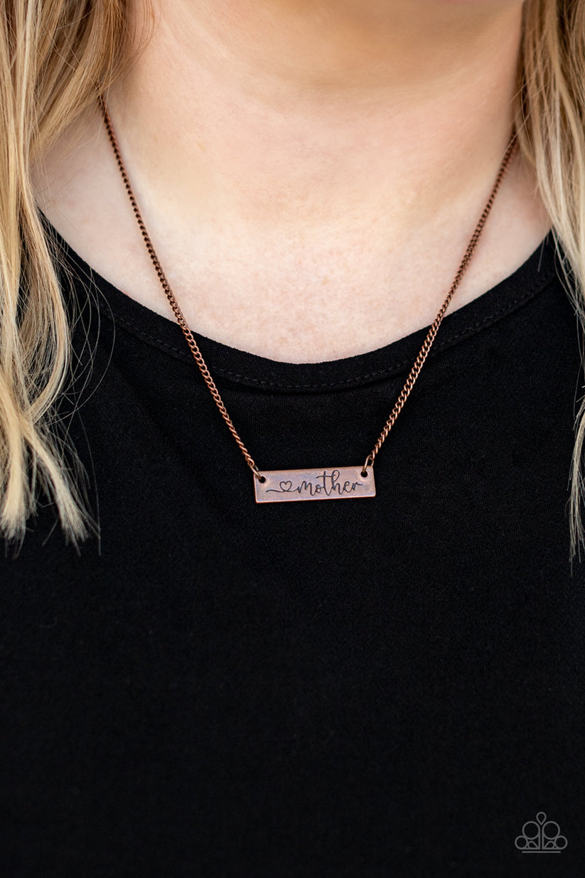 Joy Of Motherhood - Copper Necklace - Paparazzi Accessories - Stamped in a heart and the word, "Mother," an antiqued copper plate is suspended by a classic copper chain below the collar, creating a whimsy sentimental pendant. Features an adjustable clasp closure.