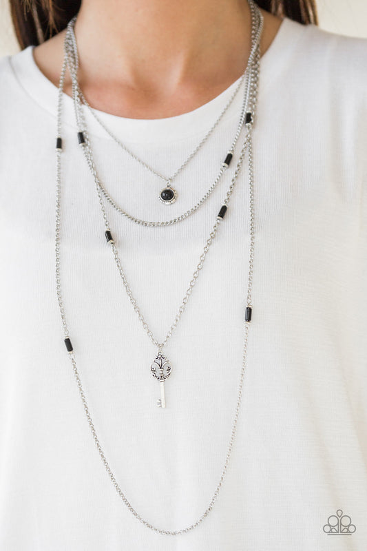 Key Keynote - Black and Silver Necklace - Paparazzi Accessories - Featuring shiny black and dainty silver accents, a black beaded pendant gives way to a shimmery silver key for a whimsically layered look.