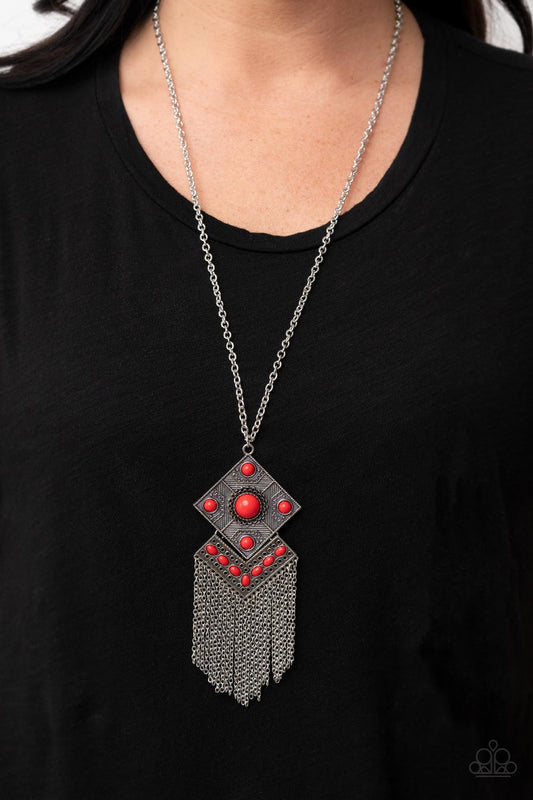 Kite Flight - Red Necklace - Paparazzi Accessories - A curtain of silver chains stream out from the bottom of stacked silver frames embellished in bubbly red beads and antiqued silver textures, resulting in a whimsical kite shaped pendant at the bottom of an extended silver chain.