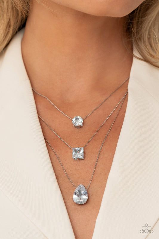 Lustrous Layers - White and Silver Necklace - Paparazzi Accessories - Featuring a subtle iridescent finish, exaggerated, faceted round, square, and teardrop gems layer down the chest from three sleek silver dainty chains, in a refined fashion.