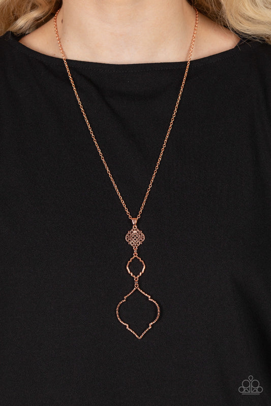Marrakesh Mystery - Copper Necklace - Paparazzi Accessories - Featuring mandala-like patterns, a floral lattice frame gives way to mismatched scalloped shiny copper frames, creating a magnificently stacked pendant at the bottom of an extended shiny copper chain.