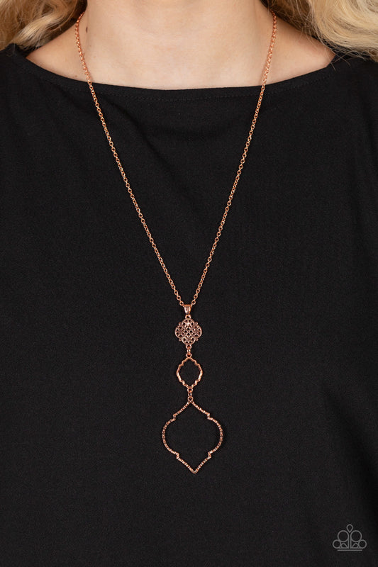Marrakesh Mystery - Copper Necklace - Paparazzi Accessories - Featuring mandala-like patterns, a floral lattice frame gives way to mismatched scalloped shiny copper frames, creating a magnificently stacked pendant at the bottom of an extended shiny copper chain.